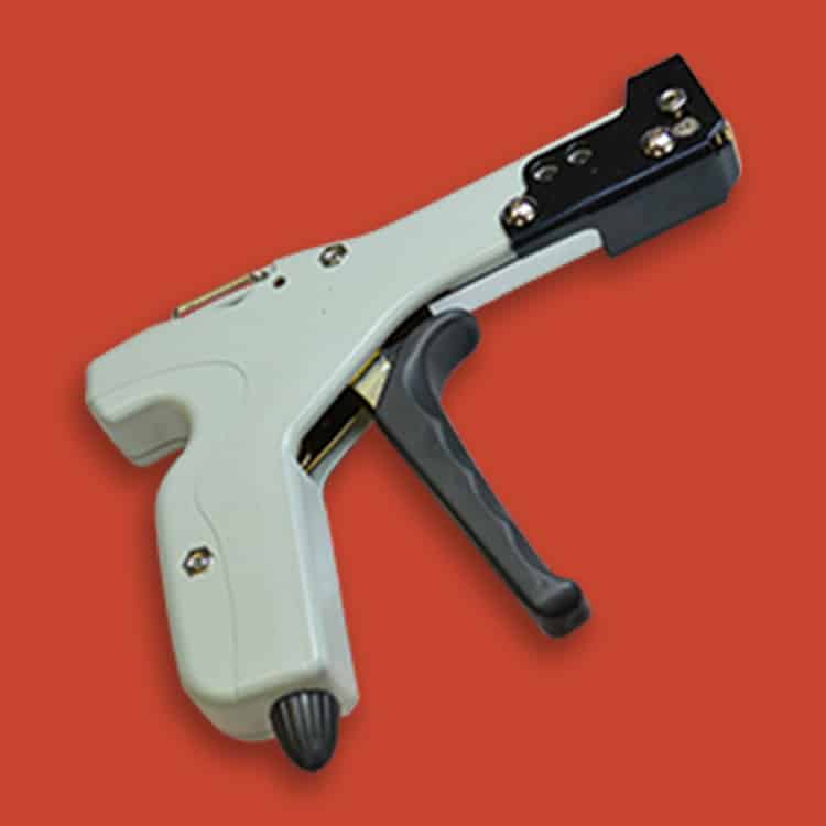 The Stainless Steel Cable Tie Gun, in white and black, is a handheld tool for attaching price tags or labels, displayed against a solid red background.